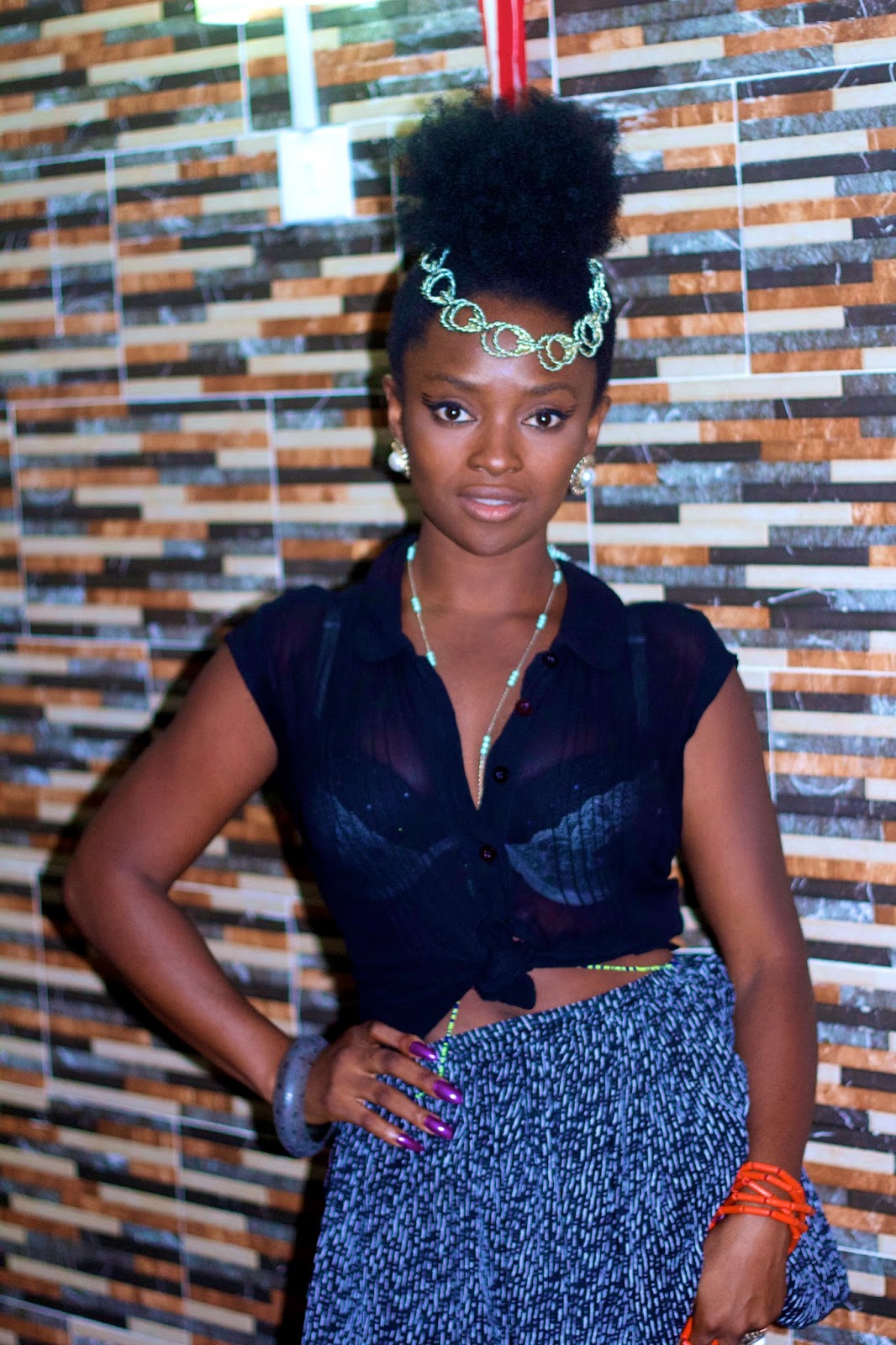 Nigerian singer Ify Otuya wears a see-through top and short skirt in photo from July 4 weekend.